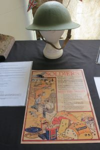 WW1 helmet and poster about the dangers of flies (perhaps an unexpected war hazard to many)