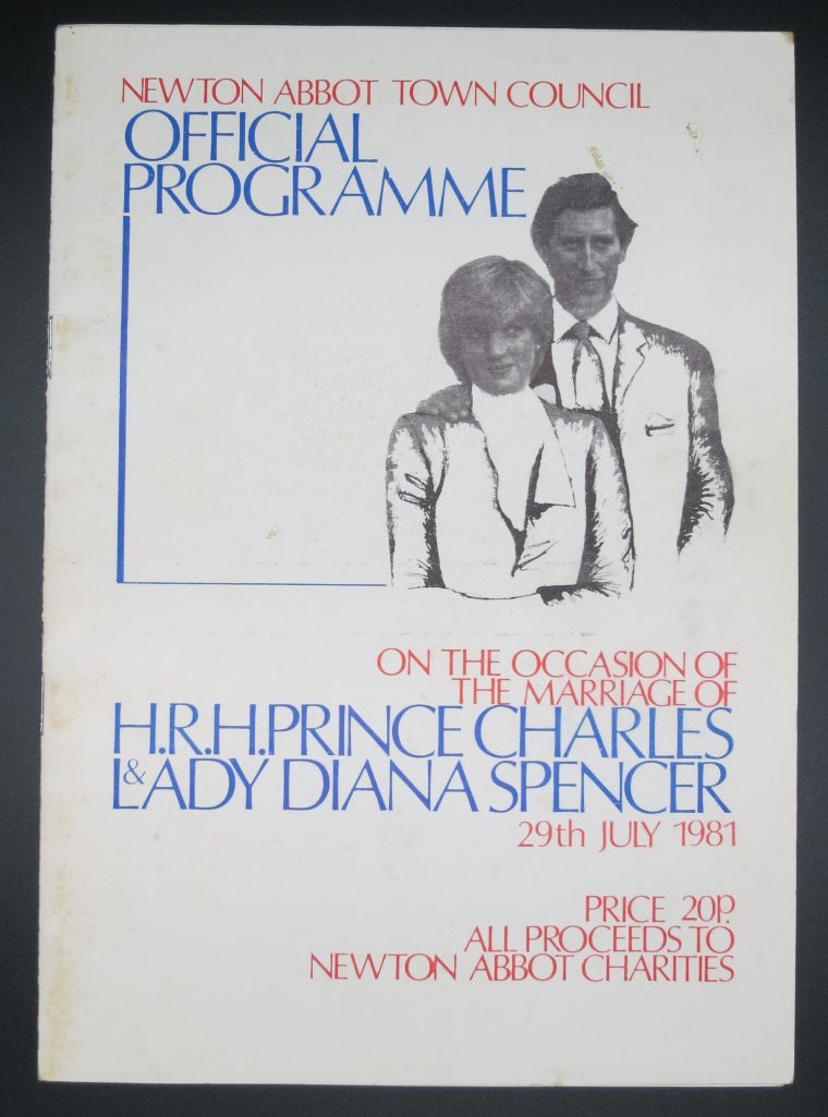 White Programme with blue and red text. Text reads:
Newton Abbot town council
Official Programme
On the occasion of the marriage of
H.R.H.Prince Charles & Lady Diana Spencer 29 July 1981 Price 20p all proceeds to Newton Abbot charities