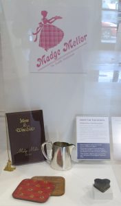 These table mats, menu, coffee jug and heart shaped cooking tin were once used in Madge Mellor’s café