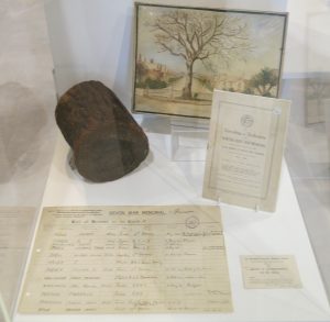 This piece of wood is from the tree which was cut down to make way for the War Memorial (unveiled in 1922)